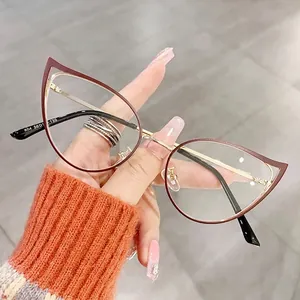 Fashionable red and gold cat-eye glasses with hollow metal frames for a stylish look