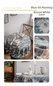 Detailed macro shot of vintage blue floral tablecloth fabric with white tassel fringe