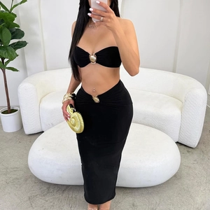 Sexy black two-piece set with tube top and maxi skirt featuring gold shell metal details