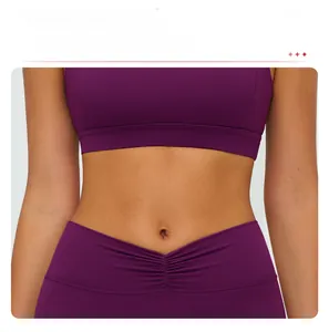 Detail of wide supportive hem on high-elastic plum purple sports bra for fitness