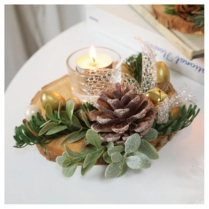 Detail of forest style Christmas wood candle holder with pine cones and golden bells