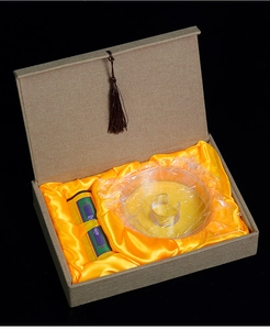 Top-down view of Agarwood incense gift box with jute texture and yellow silk lining