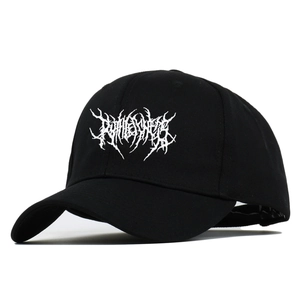 Detail of gothic punk style embroidery on black baseball cap with curved brim