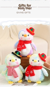 Macro view of Christmas penguins with colorful tie-dye plush and Merry Christmas scarves