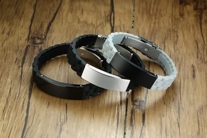 Detail of stainless steel buckle engraving on black and grey silicone bracelets for men