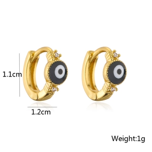 Detail view of 18K gold evil eye ear cuff showing dimensions of 1.1cm by 1.2cm