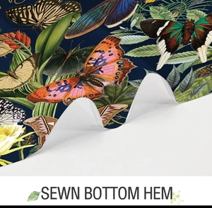 Detail of sewn bottom hem on a retro butterfly and botanical print fabric curtain