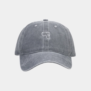 Close-up of washed gray baseball cap featuring vintage texture and minimalist embroidery