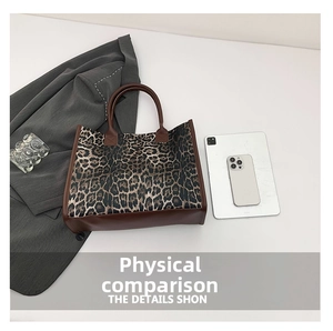 Detail shot of large leopard print tote bag showing spacious interior and size comparison