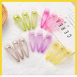 Flat lay of colorful large teardrop hair clips in translucent candy-colored resin