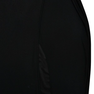 Detailed view of the black knit fabric texture showing a high slit and seam stitching