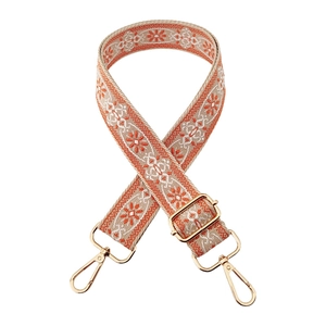 Detail of 3.8cm ethnic style bag strap with orange floral embroidery and gold hooks