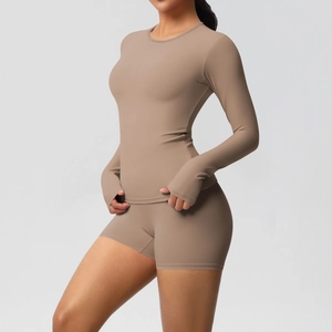 Detail of yoga set with thumbhole sleeves and high-waist shorts in matte brown