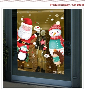 Creative Christmas window decals set with Santa and snowman on a store display glass