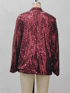 Detail of burgundy sequin blazer jacket on mannequin showing back sleeve and texture