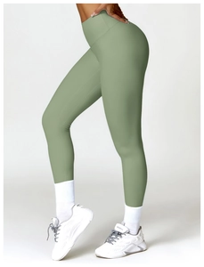 Side view of high-waisted sage green yoga leggings with butt-lifting and tummy control fit