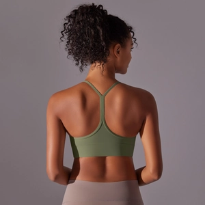 Back view of olive green Y-back yoga bra with wide hem and soft brushed fabric texture