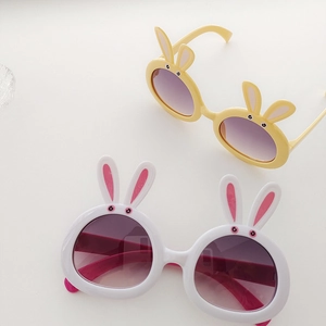 Detail of cute rabbit ear frames and purple gradient lenses on children sunglasses