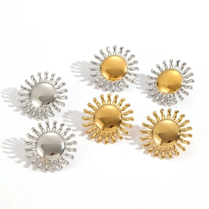 Detailed view of sunburst earrings in gold, silver, and dual-tone polished finishes