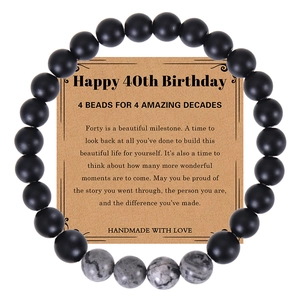 Detail of 40th birthday natural stone beads bracelet on a handmade kraft paper card