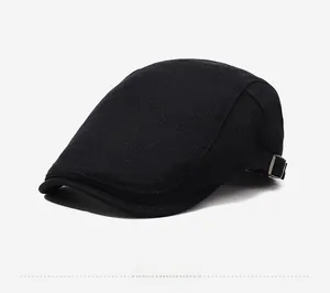 Detailed side view of black breathable mesh newsboy hat with metal buckle adjustment