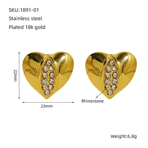 Detailed view of gold plated heart earrings with rhinestones and size specifications