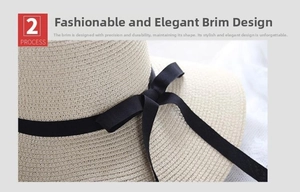 Detailed close-up of woven straw hat featuring a classic black grosgrain ribbon bow