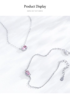 Detailed macro view of S925 sterling silver necklace with pink gemstone pendant and chain