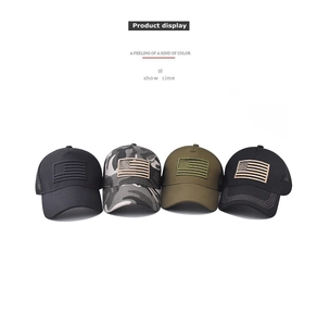 Detail view of mesh baseball caps in four colors featuring American flag patches