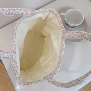 Interior view of floral cotton tote bag showing spacious off-white canvas lining