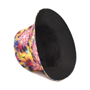 Detail view of tie-dye bucket hat with colorful kaleidoscope print and black lining