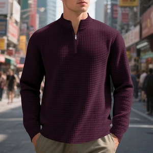 Detailed waffle texture on a men's deep purple quarter-zip pullover with high stand collar