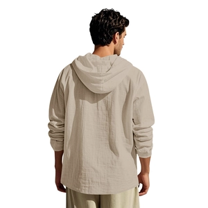 Rear view of men's loose linen hooded shirt in beige showing fabric texture and hood detail