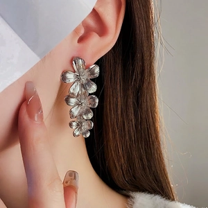 Vintage silver metal flower tassel earrings featuring three-layer brushed texture floral design