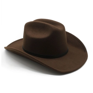 Detailed view of a brown felt cowboy hat featuring a classic black band and wide curved brim