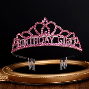 Detail of silver birthday girl crown with pink rhinestones and secure hair combs