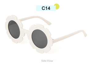Side view of white flower-shaped kids sunglasses with round dark lenses, model C14