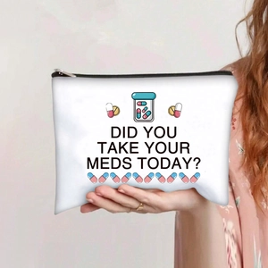 Detailed shot of canvas makeup bag with 'Did You Take Your Meds Today?' graphic print