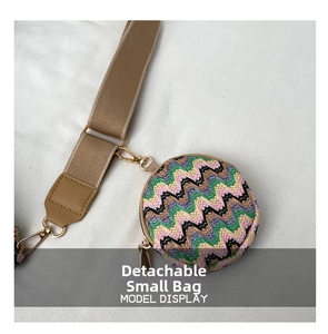 Close-up of a detachable round knitted mini pouch with a colorful wave pattern