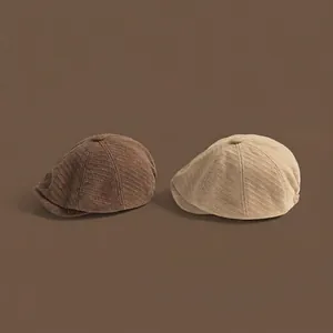 Vintage wool herringbone newsboy caps in brown and beige colors for autumn winter