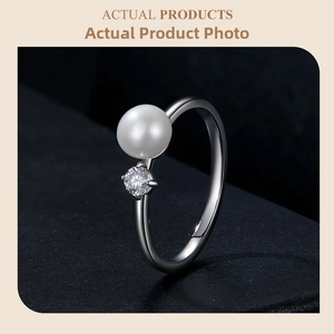 Macro shot of S925 sterling silver ring showing the natural pearl and moissanite detail
