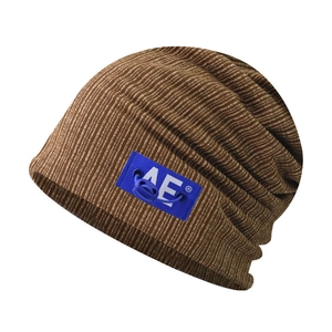 Detail of brown knitted beanie showing fine ribbed texture and blue AE logo patch