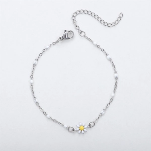 Detailed macro view of 18K gold daisy bracelet with white beads and adjustable lobster clasp