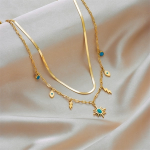 Double-layered gold titanium necklace with turquoise evil eye and lightning charms