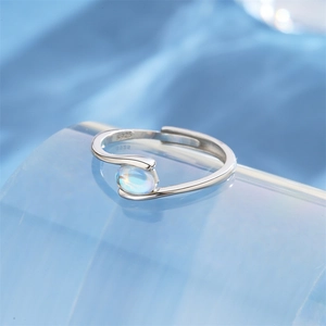 Detailed macro view of S925 sterling silver adjustable ring with round blue moonstone