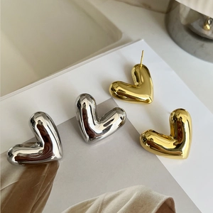 Minimalist 18k gold and silver plated hollow heart stud earrings in high-polish finish