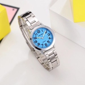 Macro view of kids quartz watch with light blue dial and silver steel strap