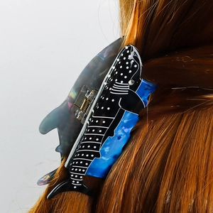 Blue whale shark printed hair claw clip with white dots on long brown hair