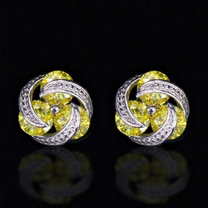 Fashionable floral swirl stud earrings with yellow cubic zirconia and silver base