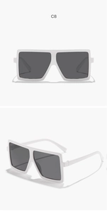 Macro detail of kids square oversized sunglasses with white frames and dark gray lenses